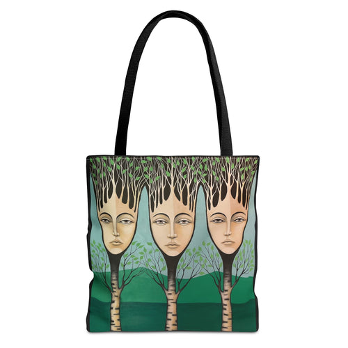 Tote bag with artistic design of three faces among trees on a green background