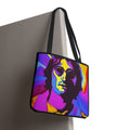 Tote bag with a colorful portrait design on a plain background