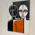 Abstract artwork with two stylized faces on a black, white, and orange background