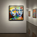Art gallery with colorful abstract paintings on white walls
