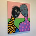 Abstract artwork with two faces on a colorful background