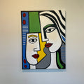 Abstract artwork with colorful faces on a white background